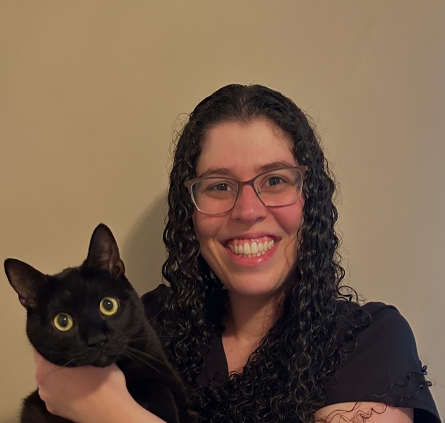 Dr. Geri Roth holding a black cat